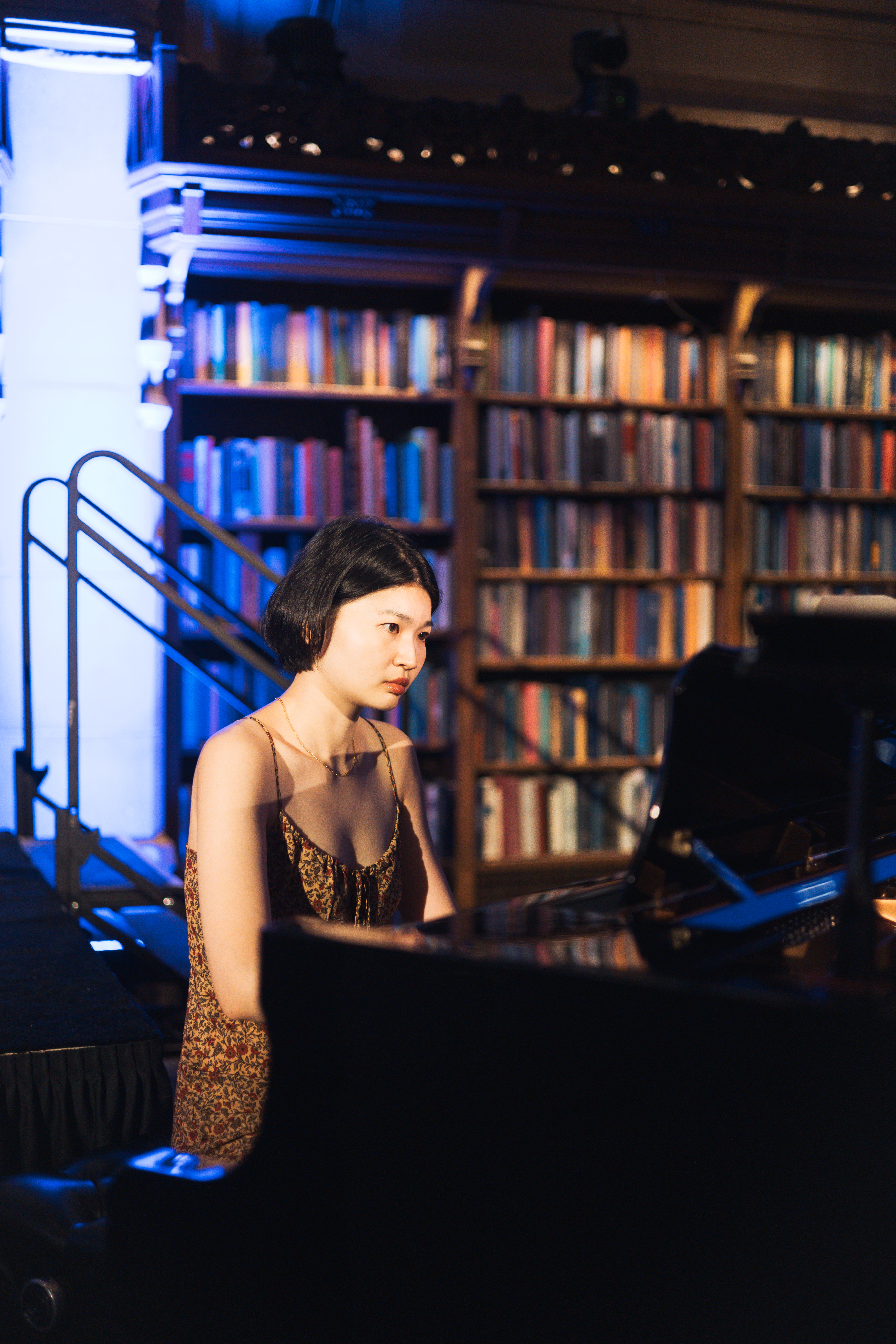 Cicy Li playing piano at an event