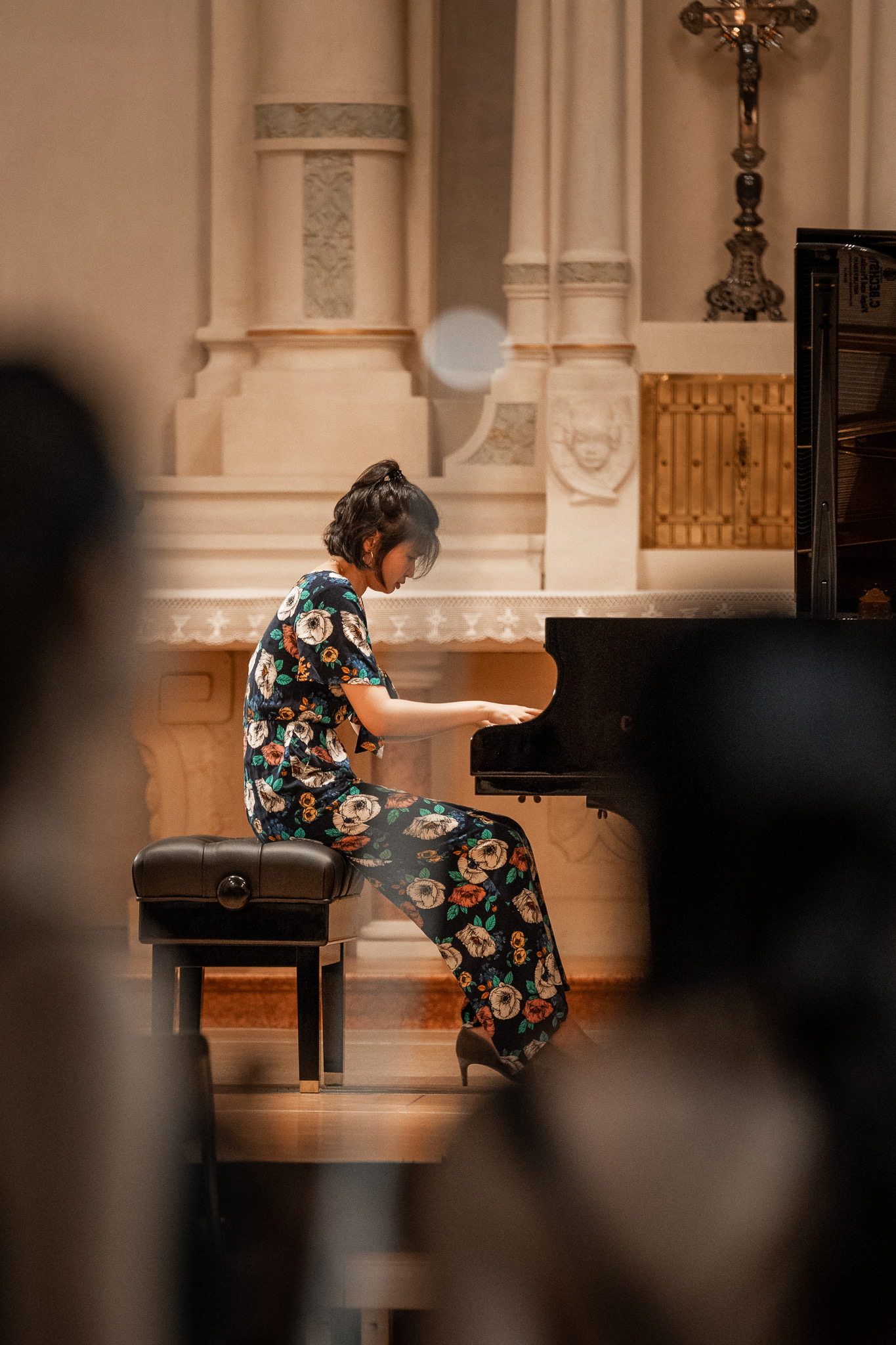 Cicy Li smiling at piano